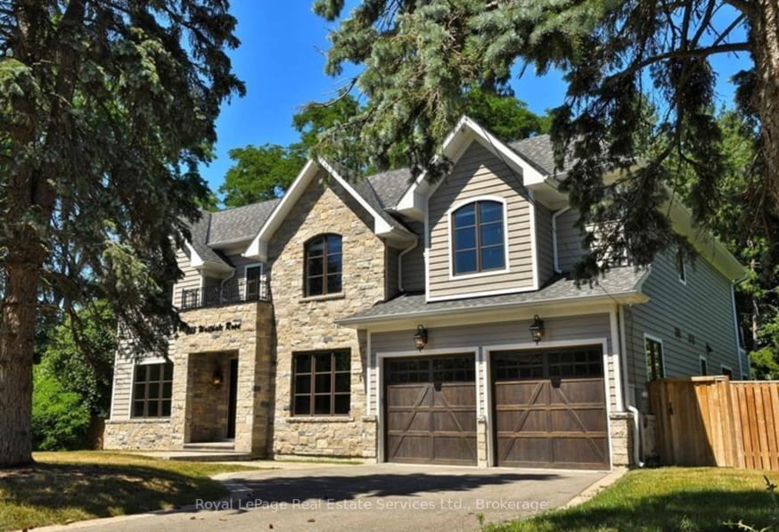 Stone-fronted family home with a double garage and newly finished driveway