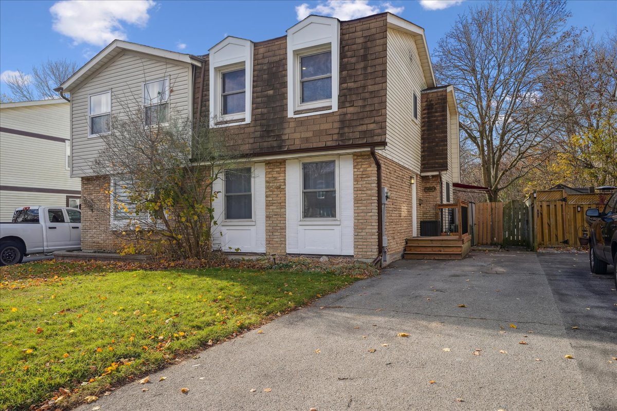 Brick and shingle two-storey home photographed before pre-sale improvements